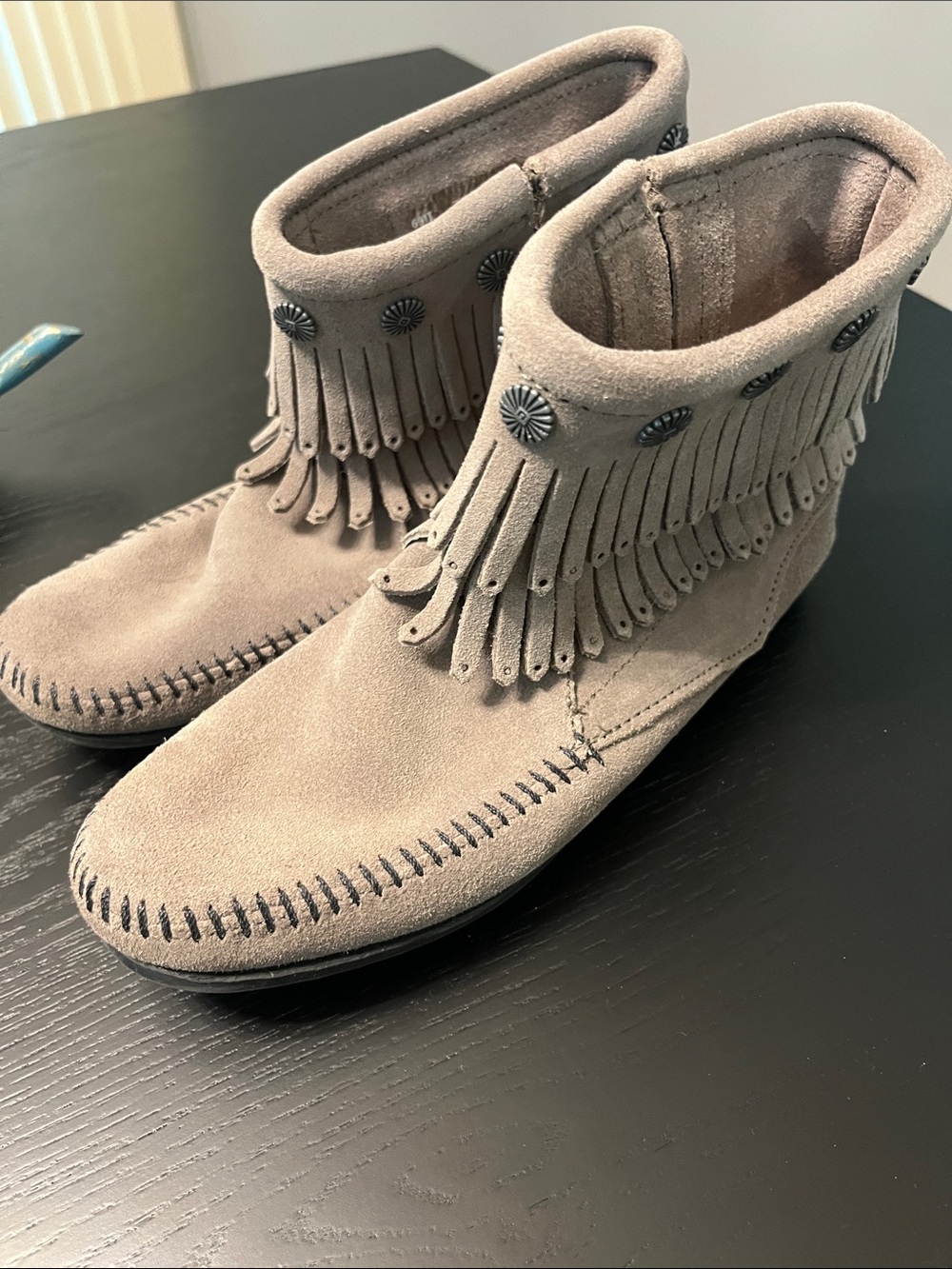 Minnetonka Suede Fringe Ankle Boots in Taupe